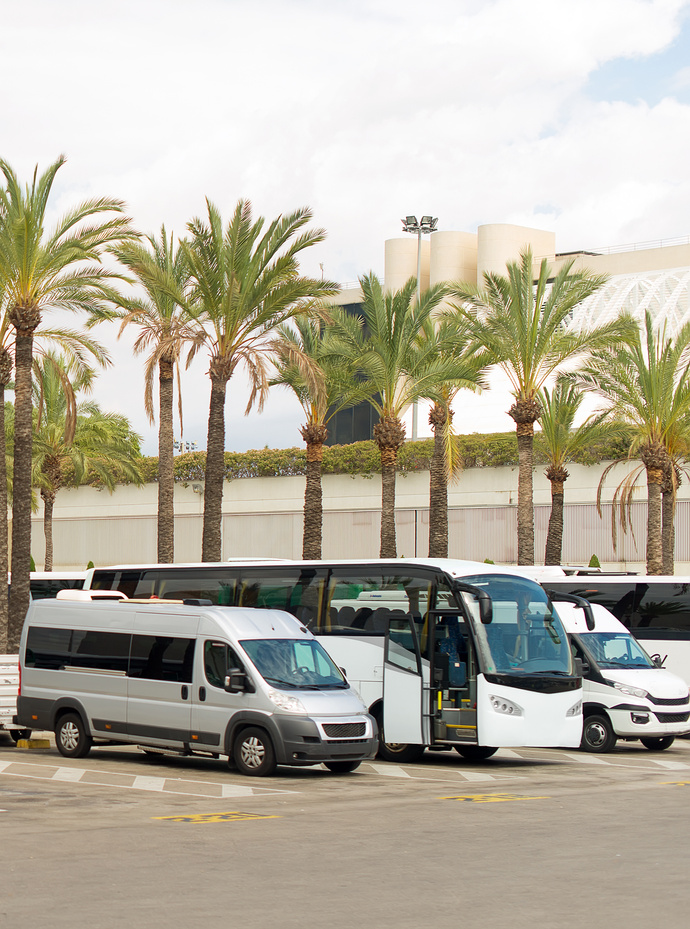 Transfer cars waiting for passengers near airport.